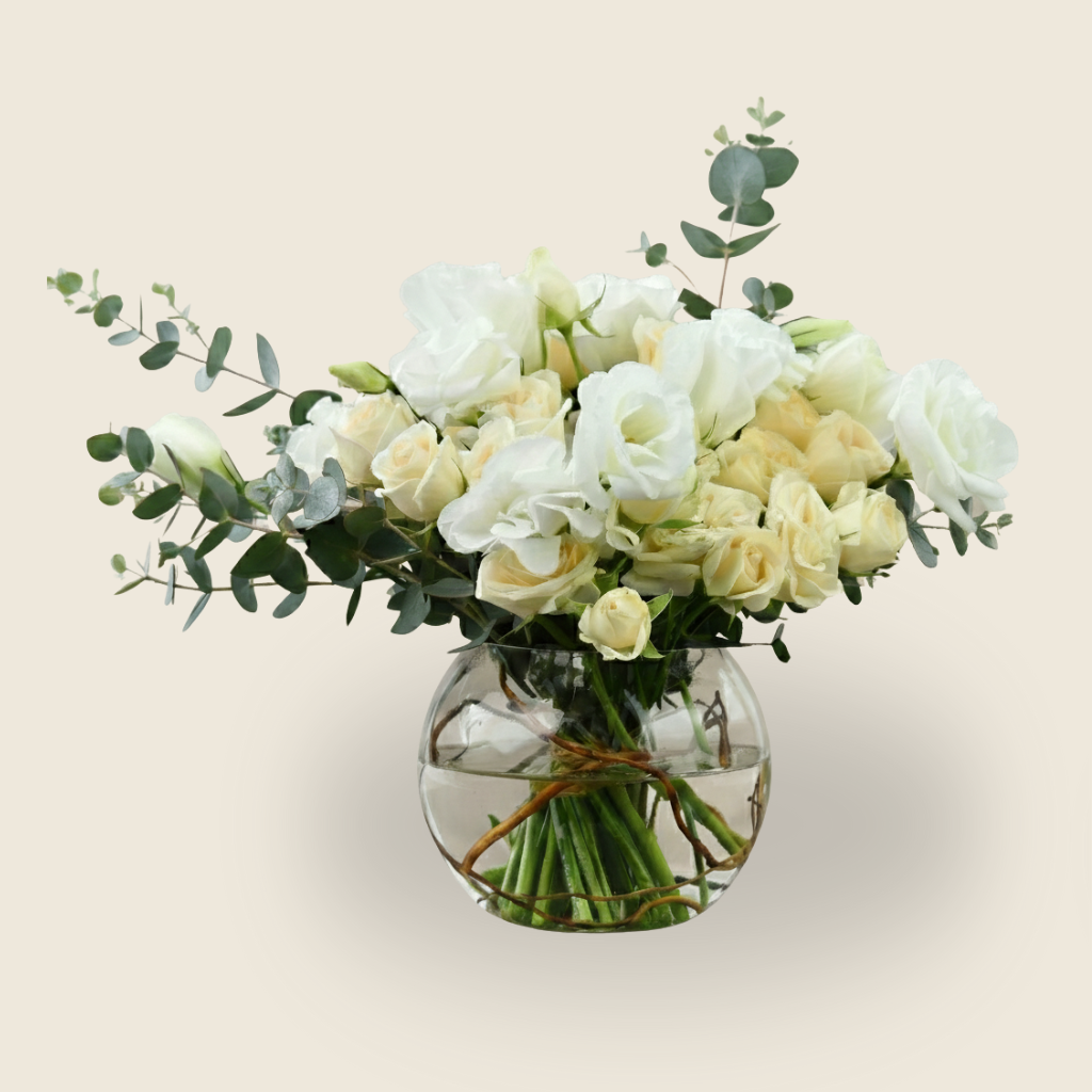 White and cream condolence flower arrangement in round vase