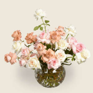 Pastel vase arrangement of blush, white and nude roses for elegant gifting