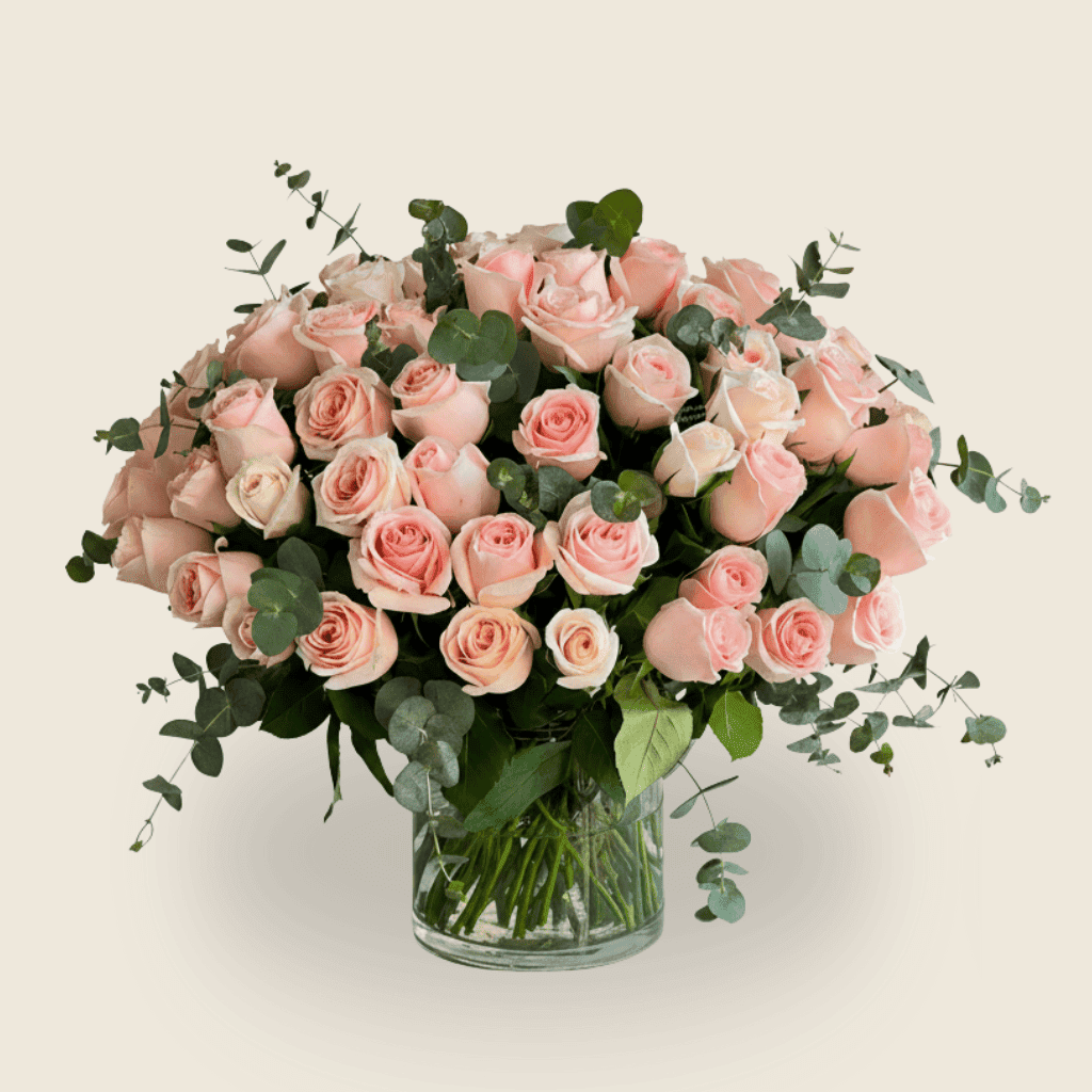 Abundant pink rose and eucalyptus vase arrangement for romantic gifting