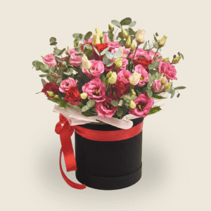 Birthday hatbox arrangement with pink Eustoma red roses, and eucalyptus