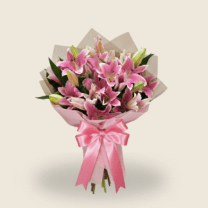 Elegant pink lily bouquet wrapped in soft beige paper for gifting
