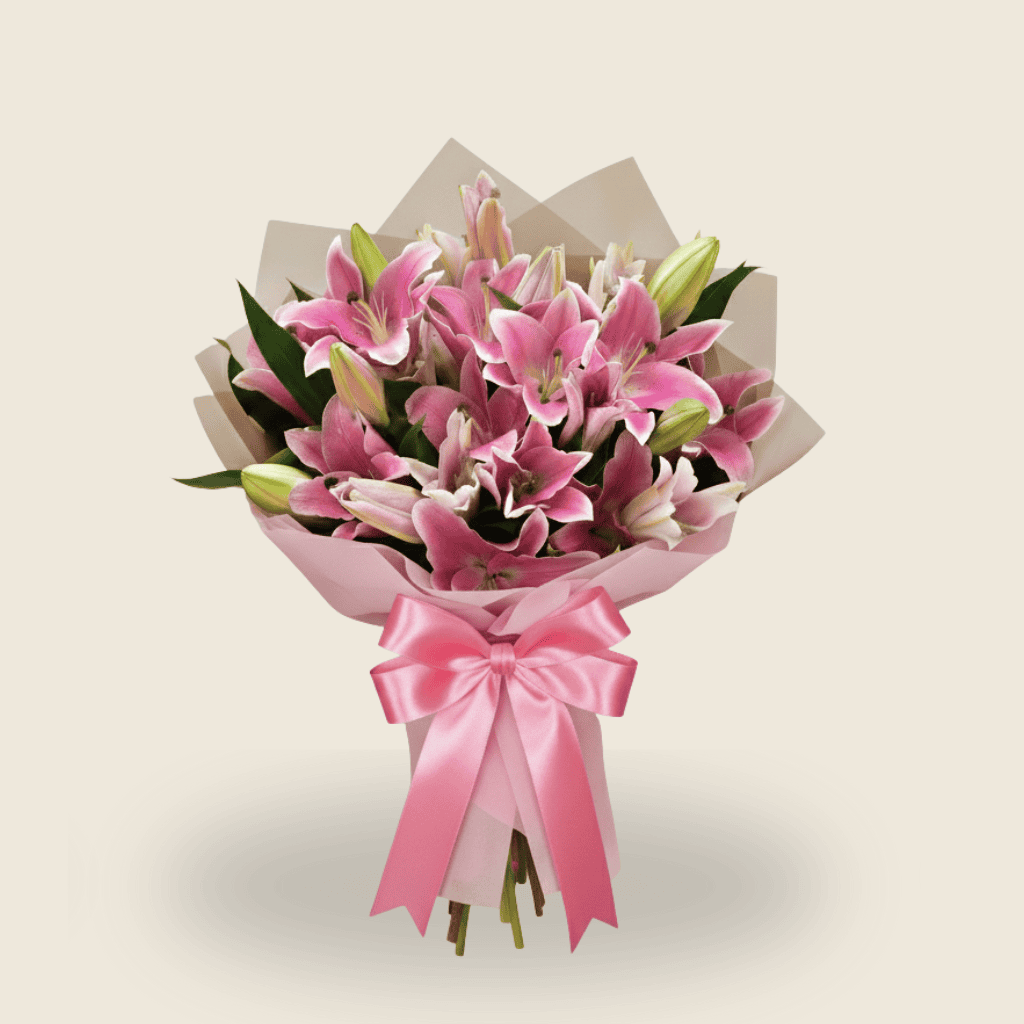 Elegant pink lily bouquet wrapped in soft beige paper for gifting
