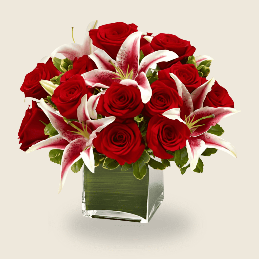 Vase arrangement of red roses with stargazer lilies