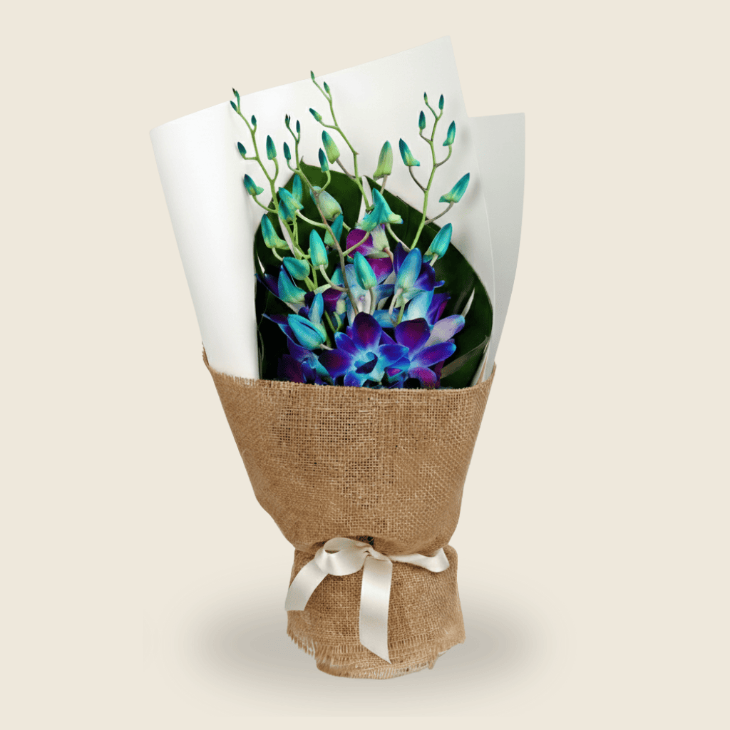 Rustic bouquet of blue orchids in jute wrapping