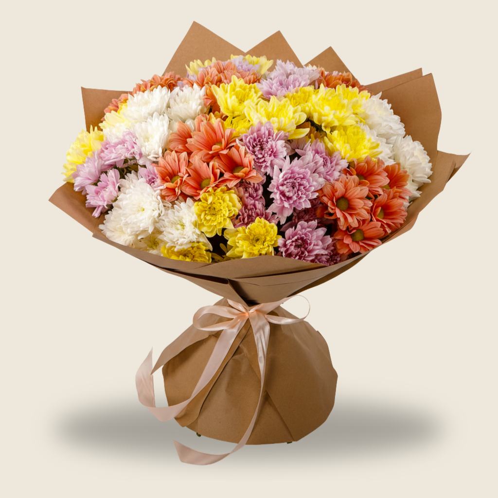 Colorful bouquet of mixed chrysanthemums wrapped in brown paper
