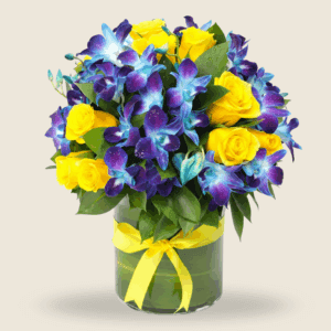 Blue orchids and yellow roses in a round vase tied with a yellow ribbon