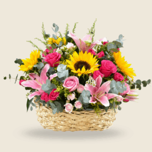 Basket arrangement with sunflowers, pink lilies, and roses