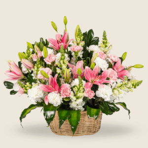Pastel pink and white floral basket arrangement with lilies and carnations
