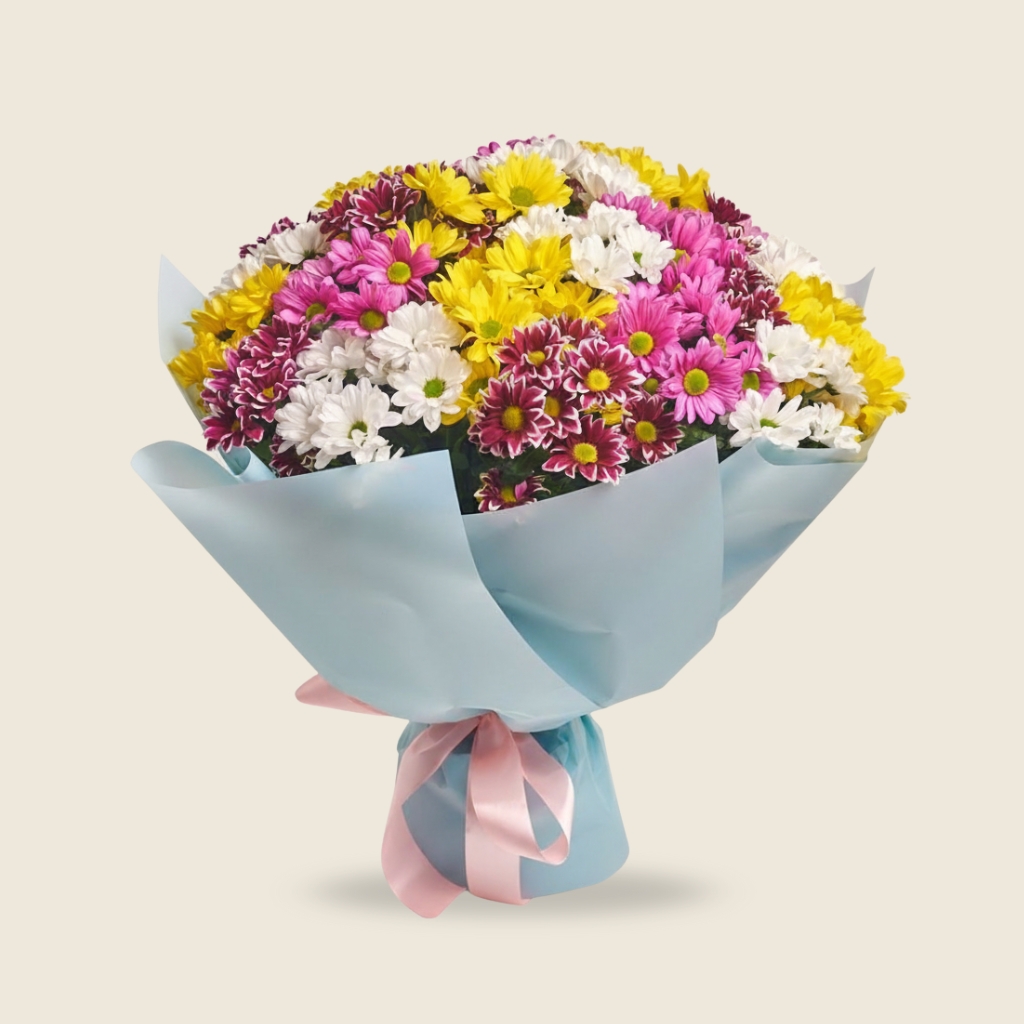 Bright mixed chrysanthemum bouquet in pastel blue wrap